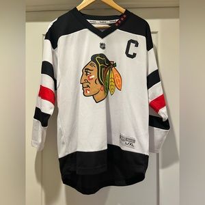 Chicago Blackhawks Jersey; fits like an adult size, just a little shorter.